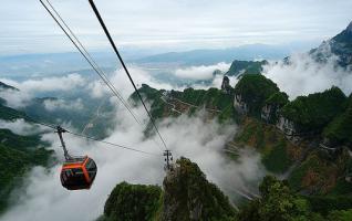 Tianmenshan in Rain and Sea of Clouds Welcoming Tourists on May Day 