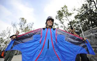 Wingsuit Flyers Conduct Trial Flight Before Sky Race in Tianmenshan 