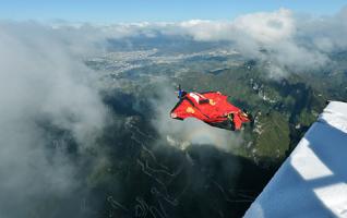 Chinese Wingsuit Flying Though Clouds after Snow 